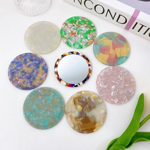Portable round acetate makeup mirrors in various retro marble and tortoiseshell patterns