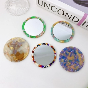 Portable round acetate pocket mirrors with vintage marble patterns and floral designs