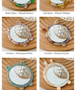 Detail of portable acetate makeup mirrors with cute cat and deer ear animal shapes