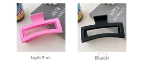 Detail view of 13CM matte rectangle shark hair clips in pink and black colors