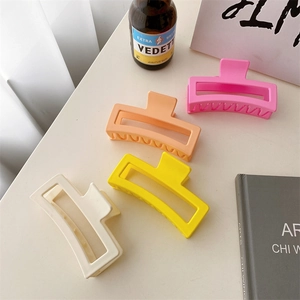 Set of four large matte square claw clips in pink, orange, yellow and cream colors