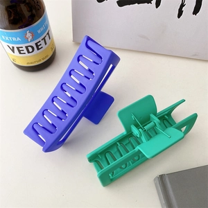 Matte rectangular hollow hair claw clips set in purple and green colors for women