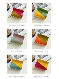Detailed grid of six bicolor acetate hair claws in vibrant geometric split designs
