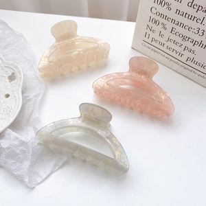 Three-piece large colorful acetate hair claws in cream, pink, and marble grey finish