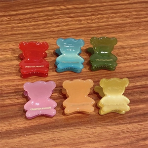Set of six bear-shaped acetate hair claws in pastel colors with gold France lettering