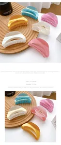 Detail shot of a candy-colored acetate hair claw clip showing 7.9x3.8cm dimensions