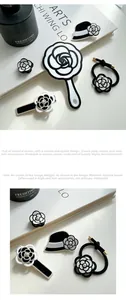 Detail of camellia hair clips and hand mirror set made of high-quality acetate material
