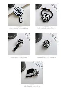Detailed set of French style camellia hair accessories with mirrors and clips in black and white