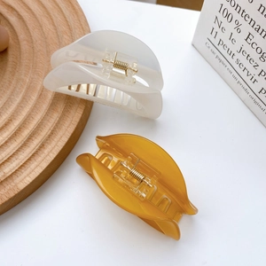 Minimalist glossy colorful acetate hair claws in creamy white and amber tortoise shell