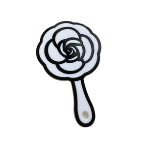 Elegant French camellia handheld makeup mirror with black and white floral design