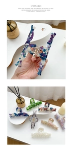 Detail of marbled acetate hair claws showing diverse colors and premium smooth textures