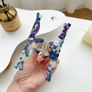 Elegant marble pattern acetate hair claw clip with blue and purple ink texture