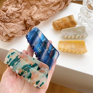 Elegant tortoiseshell acetate hair claws in various colors with France gold label