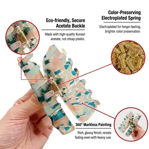 Elegant acetate hair claw clip with marble texture and premium golden metal spring