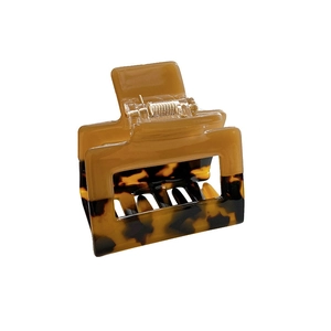 Elegant rectangular acetate hair claw clip with caramel and tortoiseshell patchwork design