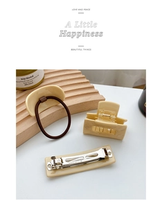 Three-piece set of cream acetate hair accessories including hair claw and metal spring clip