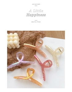 Detailed top view of 5-piece 13cm oversized iridescent hair clips in assorted colors