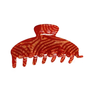 Minimalist large acetate claw clip with red and orange tiger stripe pattern for women