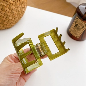 Olive green acetate rectangle hair claw clip with glossy finish and metal spring for women