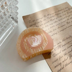 Pink and beige marbled acetate hair claw clip with vintage spiral texture