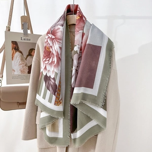 Elegant floral print shawl with retro olive green and red patterns on a soft light coat