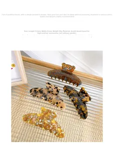Detailed size view of acetic acid bear hair claw clip with four marble patterns
