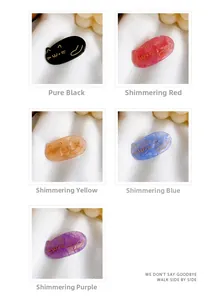 Detail of five colorful resin cat hair clips with gold outlines on soft white silk fabric