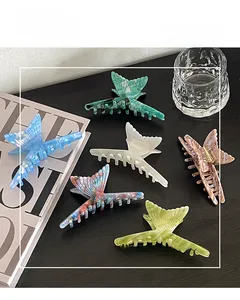Detailed set of six acetate fishtail hair claws in diverse pearlescent colors and patterns
