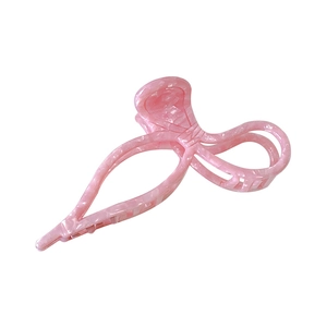 Elegant pink marble textured bow hair claw clip made of high-quality acetate material