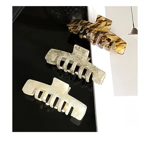 Detailed set of elegant large acetate hair claws in tortoise shell and marble patterns