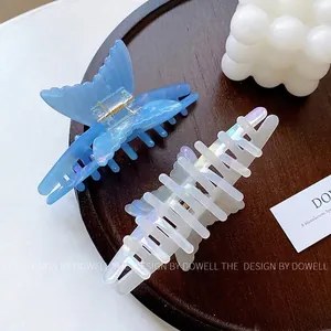 Elegant set of two large acetate butterfly hair claws in iridescent blue and pearlescent white
