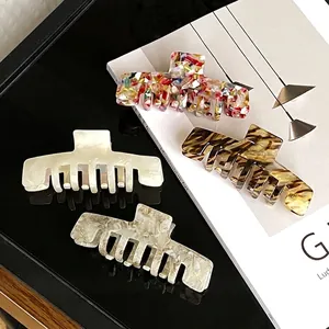 Elegant large acetate claw clips set in marble and tortoiseshell patterns for women