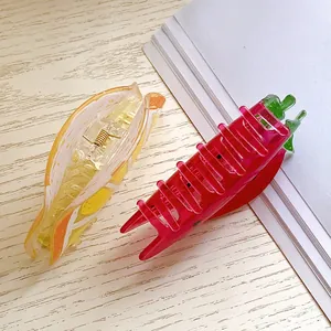 Cute fruit-shaped acrylic hair claws including strawberry and orange styles for women