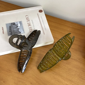 Set of two large jelly-colored hair claws in olive green and smoky grey resin