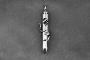 Detail of bullet pendant with embossed rose vine pattern in silver stainless steel