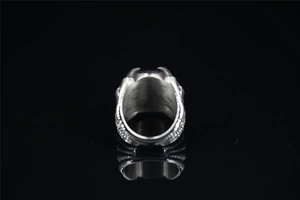 Macro shot of the thick silver stainless steel ring band with textured grain finish