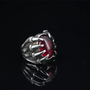 Vintage dragon claw ring for men featuring a large oval red ruby in a gothic punk style