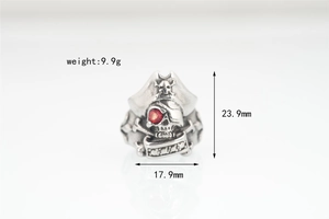 Detailed view of pirate skull ring in vintage steel with red gemstone eye and sizing specs