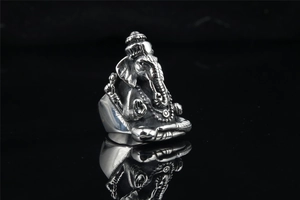 Macro shot of retro stainless steel Ganesha ring with detailed antique silver finish