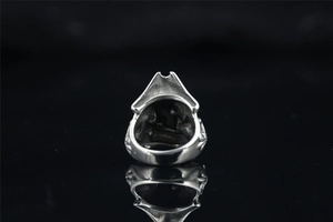 Detailed macro view of the inner band and vintage engraving on the pirate skull ring