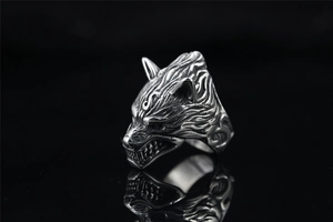 Macro view of vintage titanium steel wolf head ring with intricate punk textured details