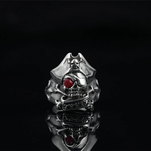 Retro stainless steel pirate skull ring for men with vintage finish and red gemstone
