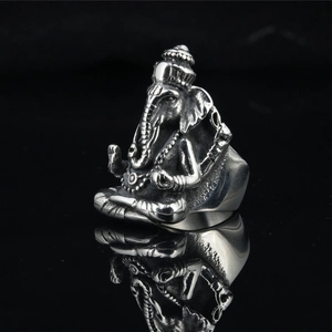 Retro stainless steel Ganesha ring for men with vintage finish on black reflection