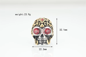 Detailed punk skull ring in silver and gold with red gem eyes and size dimensions