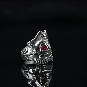 Vintage steel pirate skull ring for men with red gemstone eyes and antique silver finish
