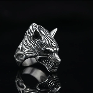 Retro punk wolf head stainless steel ring for men with vintage finish on black background