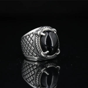 Vintage titanium steel men's ring with black onyx stone in a gothic dragon claw design