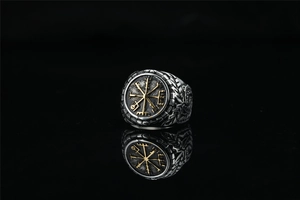 Detail of Viking Vegvisir ring with gold compass and vintage silver textured band