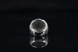 Detailed side view of punk stainless steel ring with intricate vintage relief carvings
