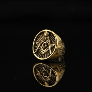 Vintage gold Freemason ring for men with All-Seeing Eye and Compass symbols on black background